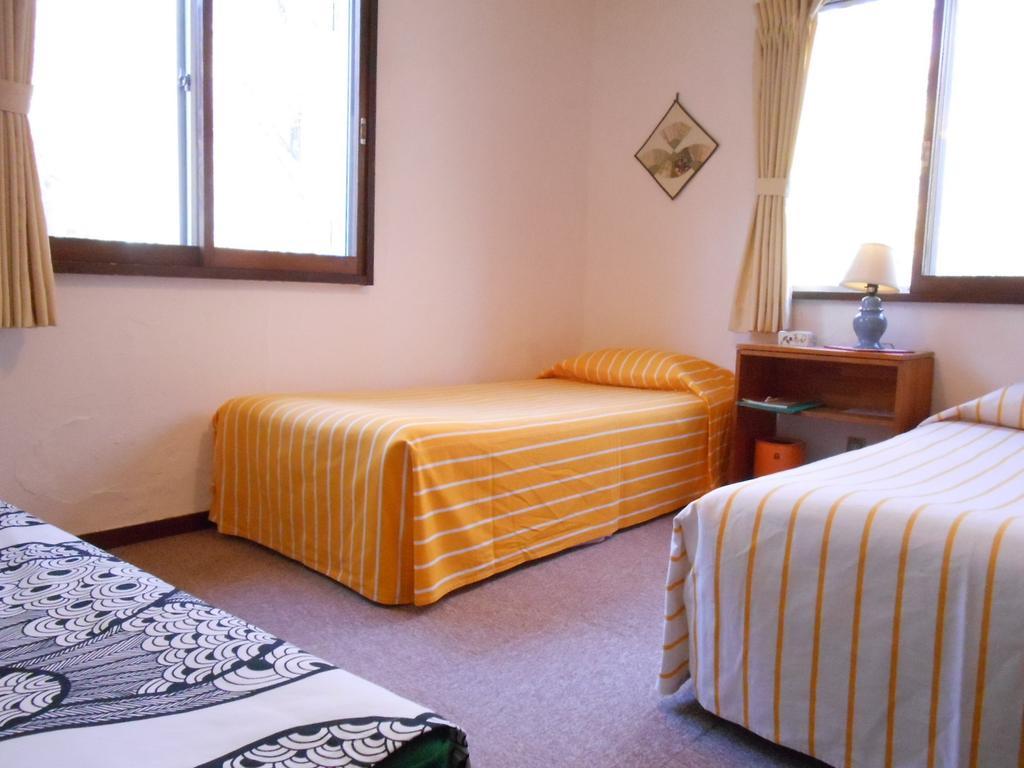 Pension Nugget Inn Hakuba Quarto foto