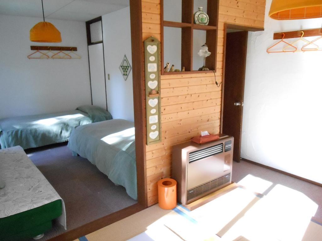 Pension Nugget Inn Hakuba Quarto foto